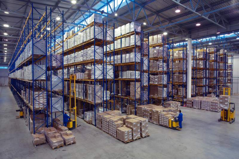 Large Warehouse With Many Pallets And Packages