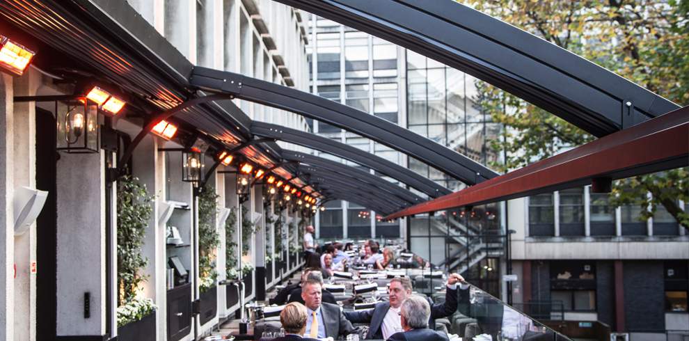Tansun Infrared Heaters Heating An Outdoor Dining Area On A Terrace