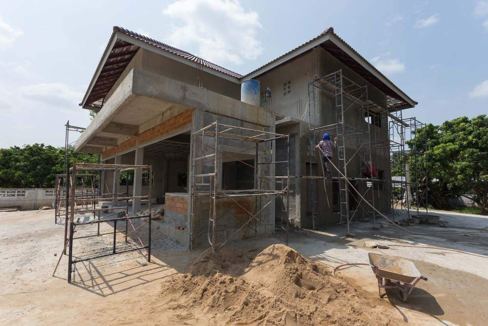 Outdoor Building Construction Site With Scaffolding For A House