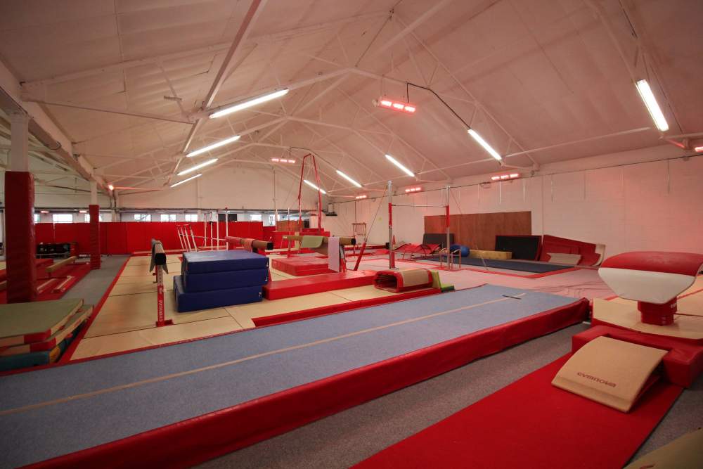 Tansun Apollo infrared space heaters installed on the ceiling and walls of the Hamilton Gymnasium Club facility