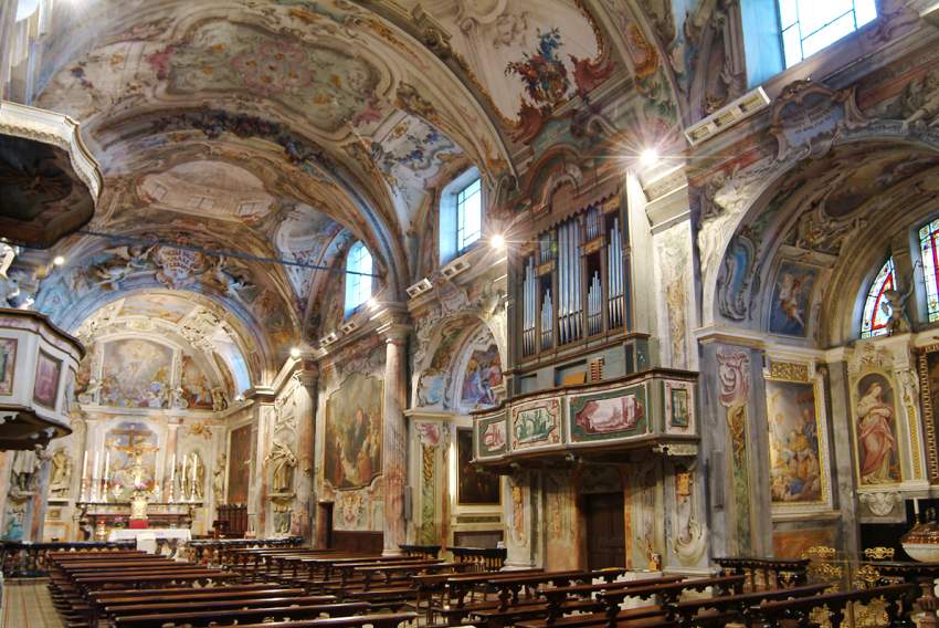 Tansun Apollo infrared space heaters mounted on the walls above the seating area inside a large church